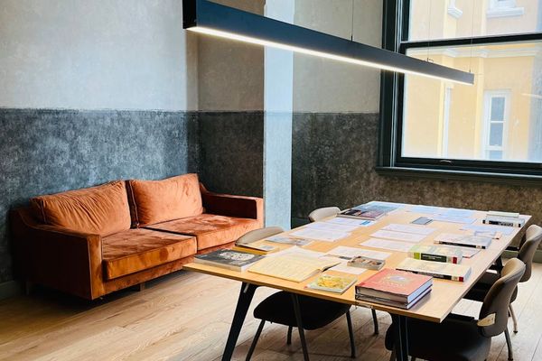 Bright and clean yoga studio interior with mats and large windows.